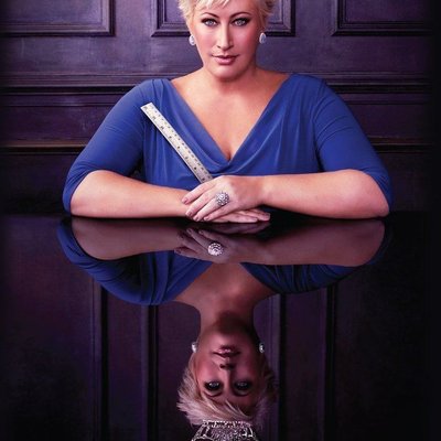 Kim of Queens logo