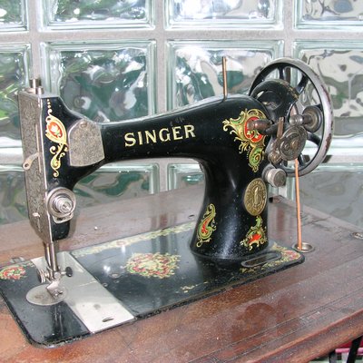 Singer Corporation logo